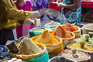 Colorful spices powders and herbs in traditional street market i