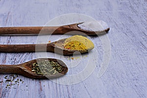 Colorful spices in spoons on white wooden background, Top view/Kitchen- Food background