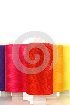 Colorful spindles of yarn