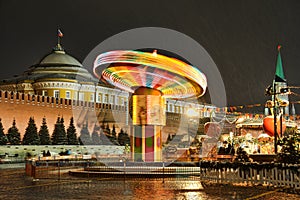 Colorful Spinning Carousel at the Red Square in Snowfall