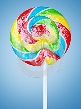 Colorful spiral lollipop on blue