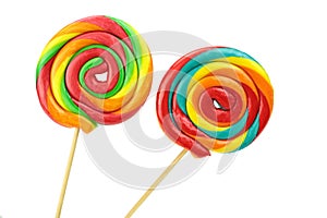 Colorful spiral lollipops on white background