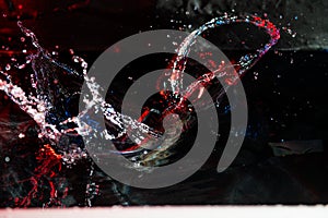 colorful splash of water on black background