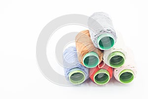 Colorful Spool of sewing thread, spool of industrial threads, Colored spools of thread on a white background