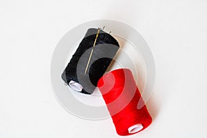 Colorful spools of sewing thread  on white background