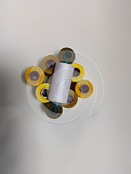 Colorful Spools of Sewing Thread on White Background