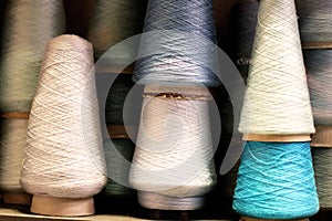 Spools of thread Blue White background in a vintage shop in Paris France photo