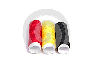 Colorful spools of thread isolated on white background/