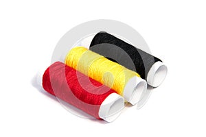 Colorful spools of thread isolated on white background/