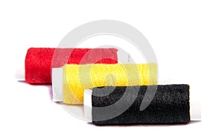 Colorful spools of thread isolated on white background/