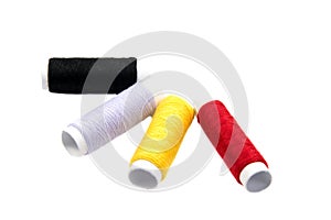 Colorful spools of thread isolated on white background/