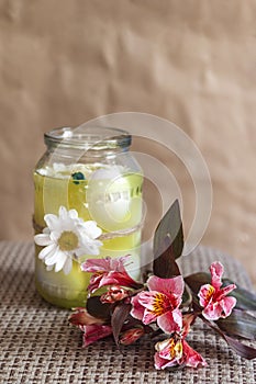 Colorful spring flower and jar full with easter eggs