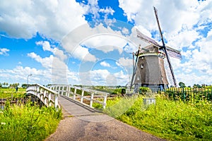 Colorful spring landscape in Netherlands, Europe. Famous windmills in Kinderdijk village in Holland.