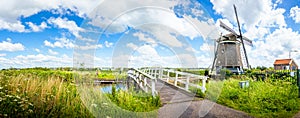 Colorful spring landscape in Netherlands, Europe. Famous windmills in Kinderdijk village in Holland. Famous tourist attraction in