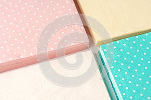 Colorful square paper napkins background top view photo