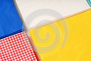 Colorful square paper napkins background top view photo