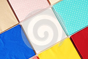 Colorful square paper napkins background top view photo