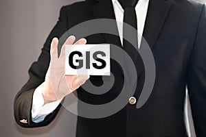 Colorful square papers with wooden white letters for the acronym word GIS