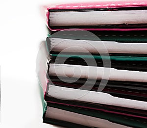 Colorful stack of notebooks close up