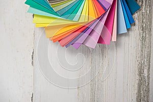 Colorful stack of sample swatches for paint or fabric in spectrum rainbow colors