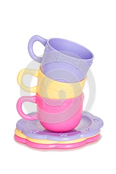 Colorful stack of toy cups and toy plates