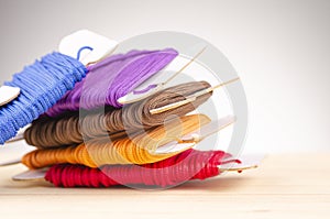 Colorful stacking cotton yarn wool over beautiful reverberation gradient background