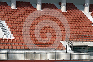 Colorful of stadium seats in background.