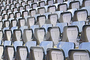 Colorful of stadium seats in background.