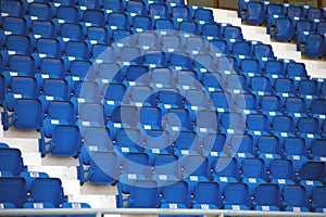 Colorful of stadium seats in background.