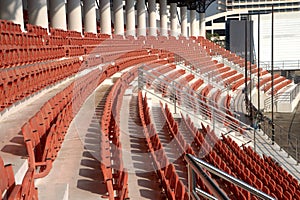 Colorful of stadium seats in background.