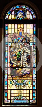 Beautiful colored stained glass window in catholic church