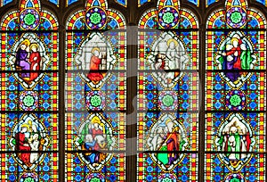 Colorful stained glass window with saints