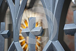 Colorful stained glass window seen through a fence in Recoleta Cemetery in Argentina photo