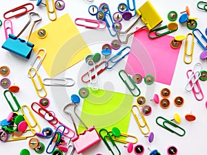 School and office supplies paper clips, pins, notes, stickers on white background