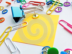 School and office supplies paper clips, pins, notes, stickers on white background