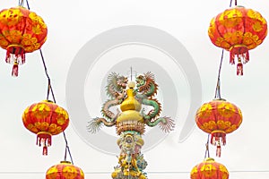 Colorful statue of Chinese dragon wrapped around the pillar. Beautiful statue of dragon carved around temple pole in Chinese