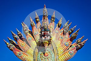 Colorful statue of the King of Nagas or Serpent king in the temple.