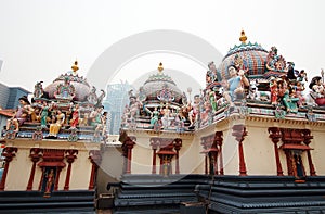 Colorful statues placed over the roof of Sri Mariamman Temple, the oldest hindu temple in Singapore