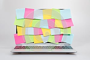 Colorful sticky memos covering a laptop screen