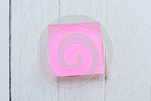 Colorful sticky note, post note on white wooden vinta photo