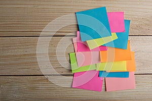 Colorful sticky notes on the plank board