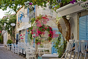 Colorful and stone houses in narrow street in Alacati cesme