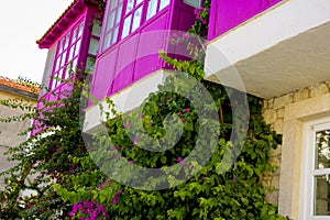 Colorful and stone houses in narrow street in Alacati cesme