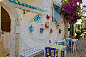 Colorful and stone houses in narrow street in Alacati cesme, izmir