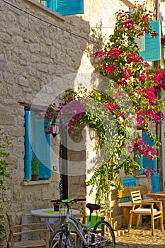 Colorful and stone houses in narrow street in Alacati cesme, izmir