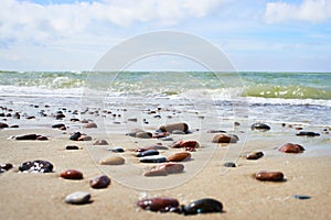 Colorful stones on sand beach