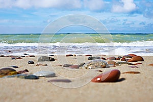 Colorful stones on sand beach