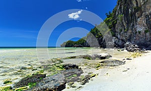 Colorful stones and white fine sand coral beach