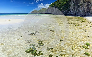 Colorful stones and white fine sand coral beach