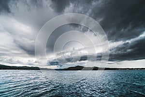 Colorful storm over Adrait Sea, beautiful clouds and stormy landscape in the summer